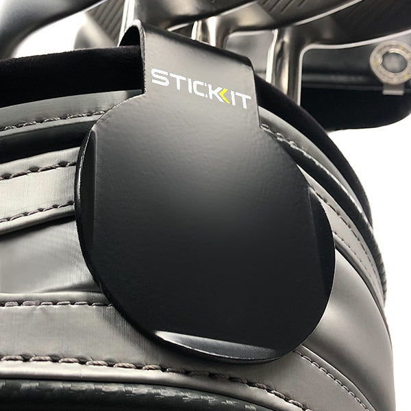 Black Stickit magnetic accessory holder for golf bags, featuring a sleek design and durable materials.