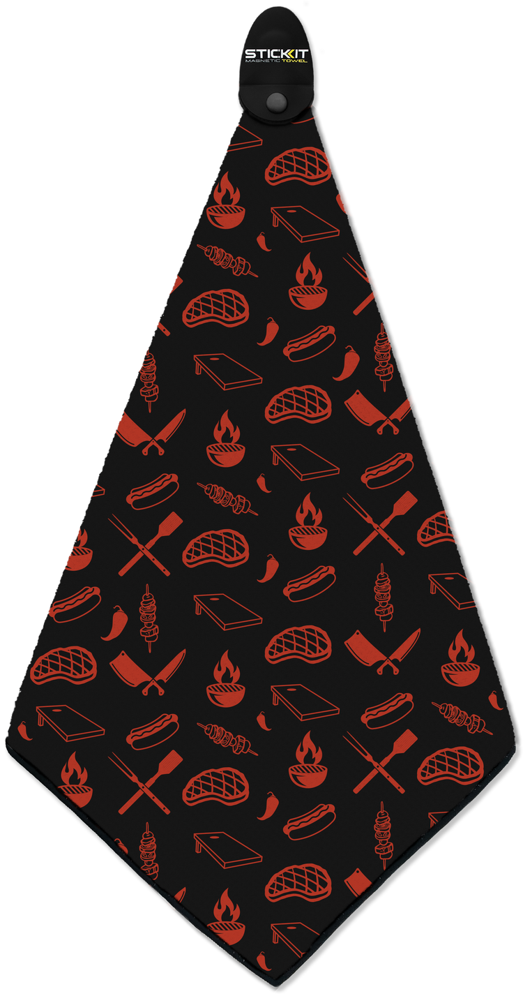 Black barbecue apron with red grill-themed graphics, featuring meats, flames, and utensils, perfect for grilling enthusiasts.
