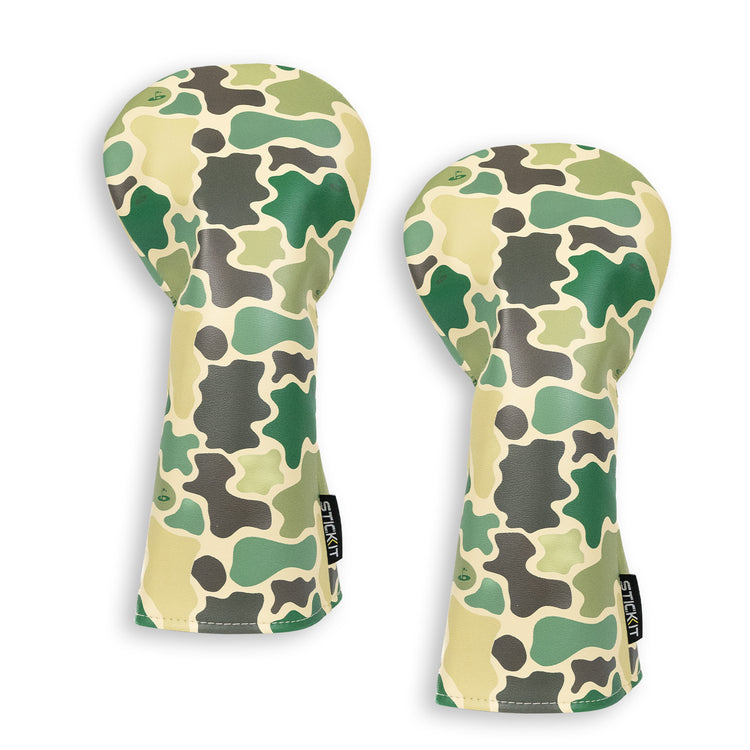 Camouflage golf club headcovers in green, beige, and brown; durable synthetic material; stylish and protective.