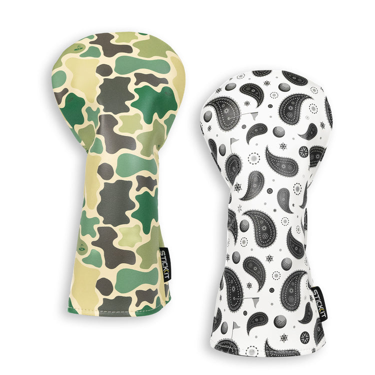 Camo and paisley-patterned oven mitts in green, beige, black, and white; durable fabric and stylish design.