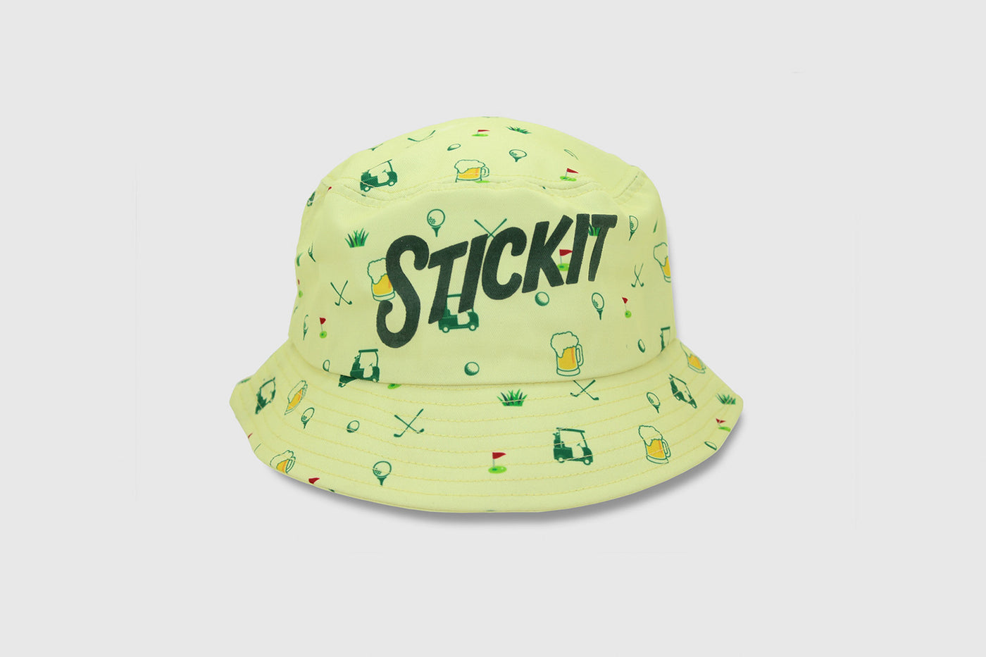 Yellow bucket hat with 'STICK IT' print, featuring a playful golf-themed pattern on cotton material.