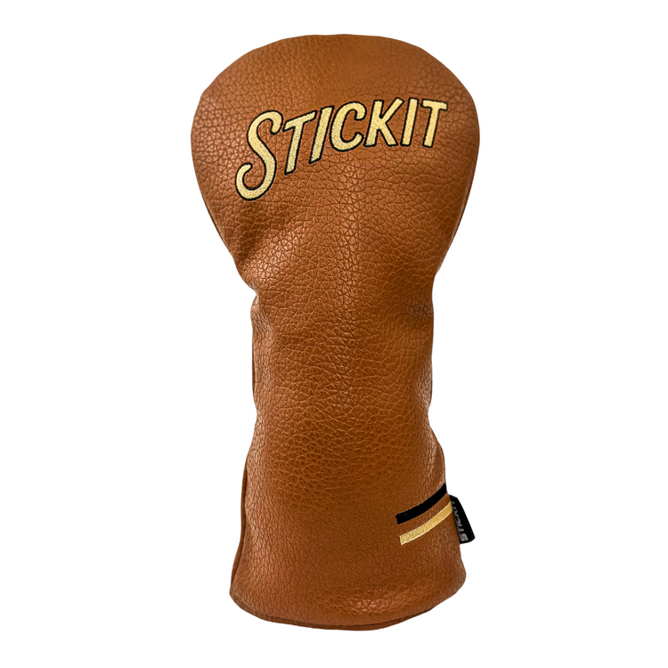 Brown leather golf headcover with retro "STICKIT" embroidery and striped accent detail.