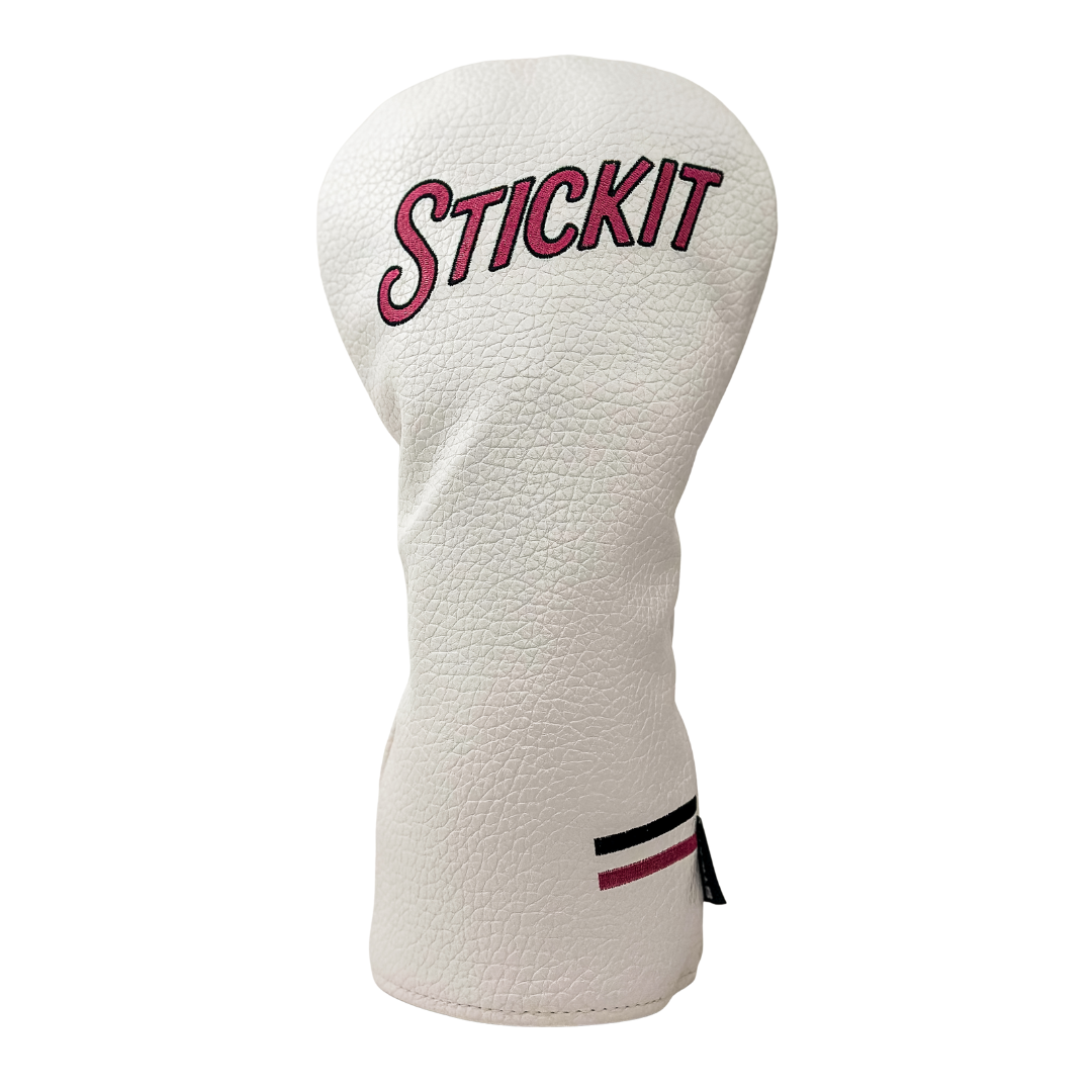 White leather golf headcover with pink "STICKIT" embroidery and black and red accent stripes.