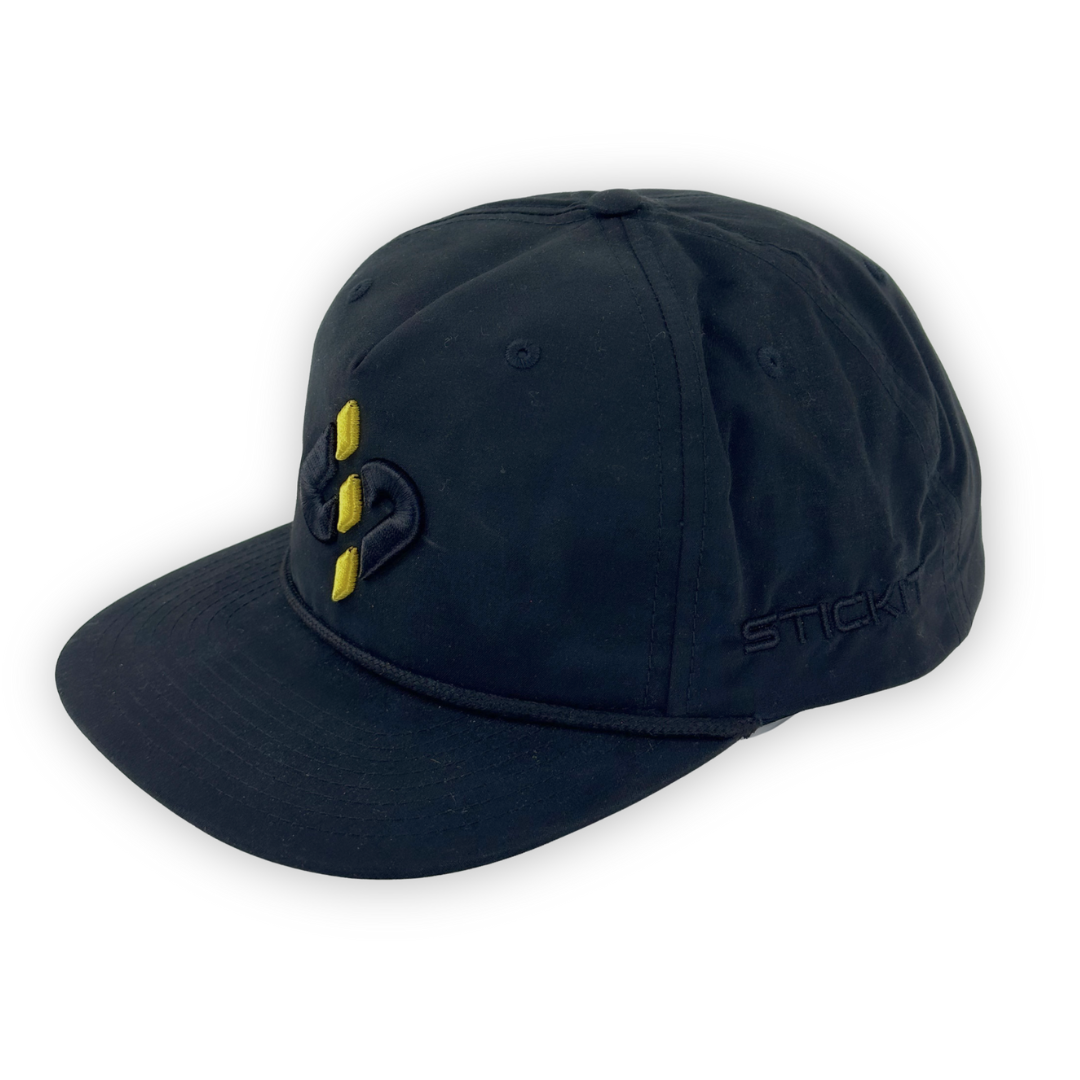 Black baseball cap with yellow embroidered logo, made of durable cotton, featuring a stylish flat brim and adjustable strap.