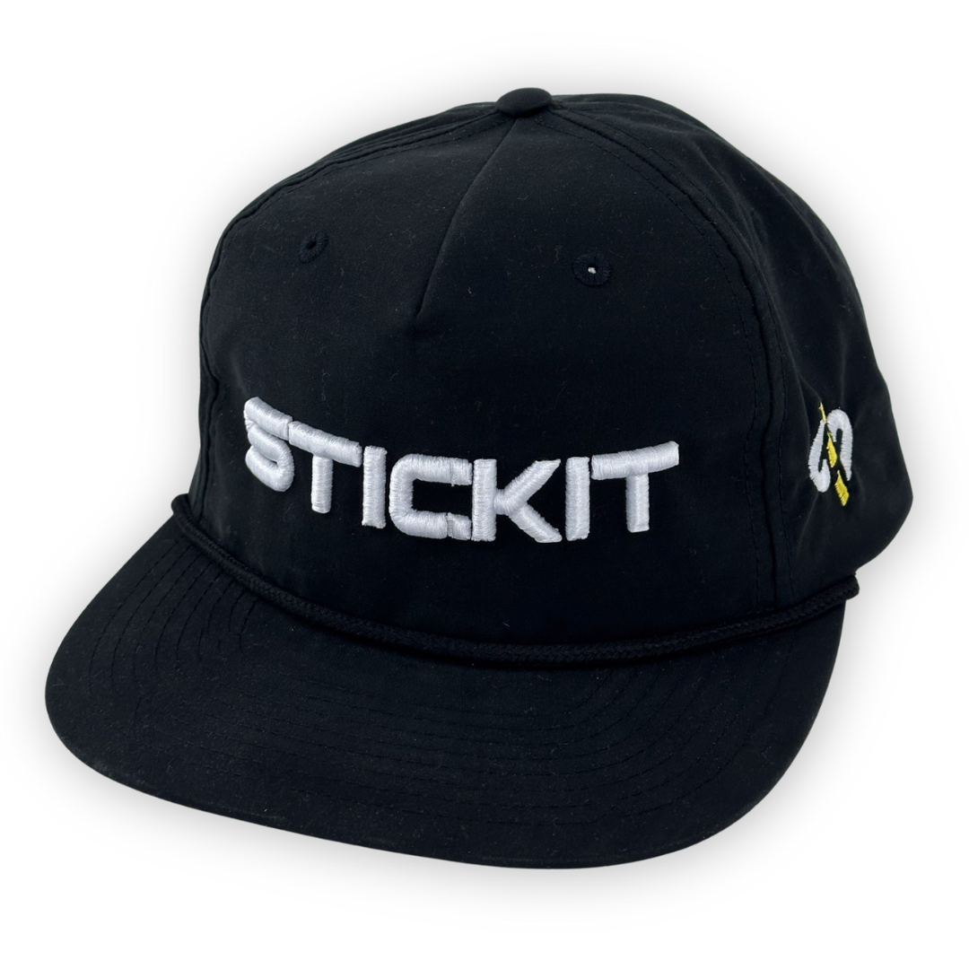 Black embroidered cap with adjustable cord and "STICKIT" logo, perfect for casual outings and sports.