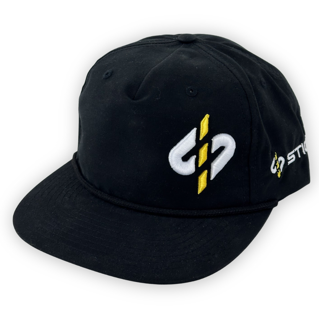 Black snapback cap with yellow embroidered logo and stylish cord detail. Perfect for casual wear and outdoor activities.