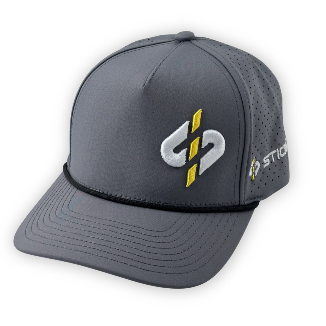 Gray performance cap with yellow and white logo, featuring breathable mesh panels and a sleek design.