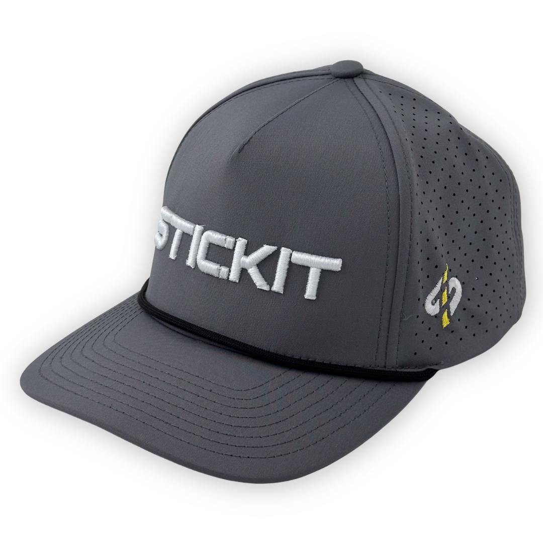 Gray performance cap with breathable mesh, featuring "STICKIT" embroidery and a sleek design. Perfect for outdoor sports.